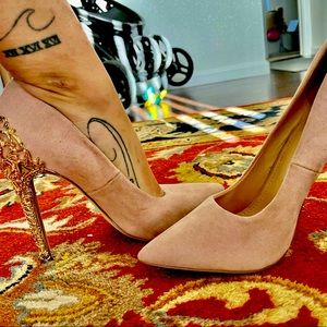 Pastel pink with gold design on the back